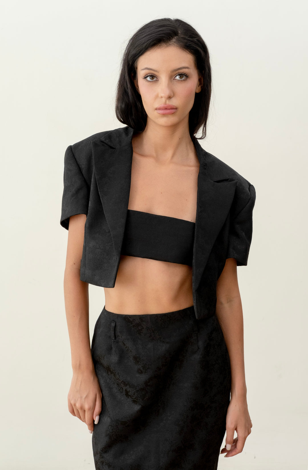 Short black print jacket with a scarf