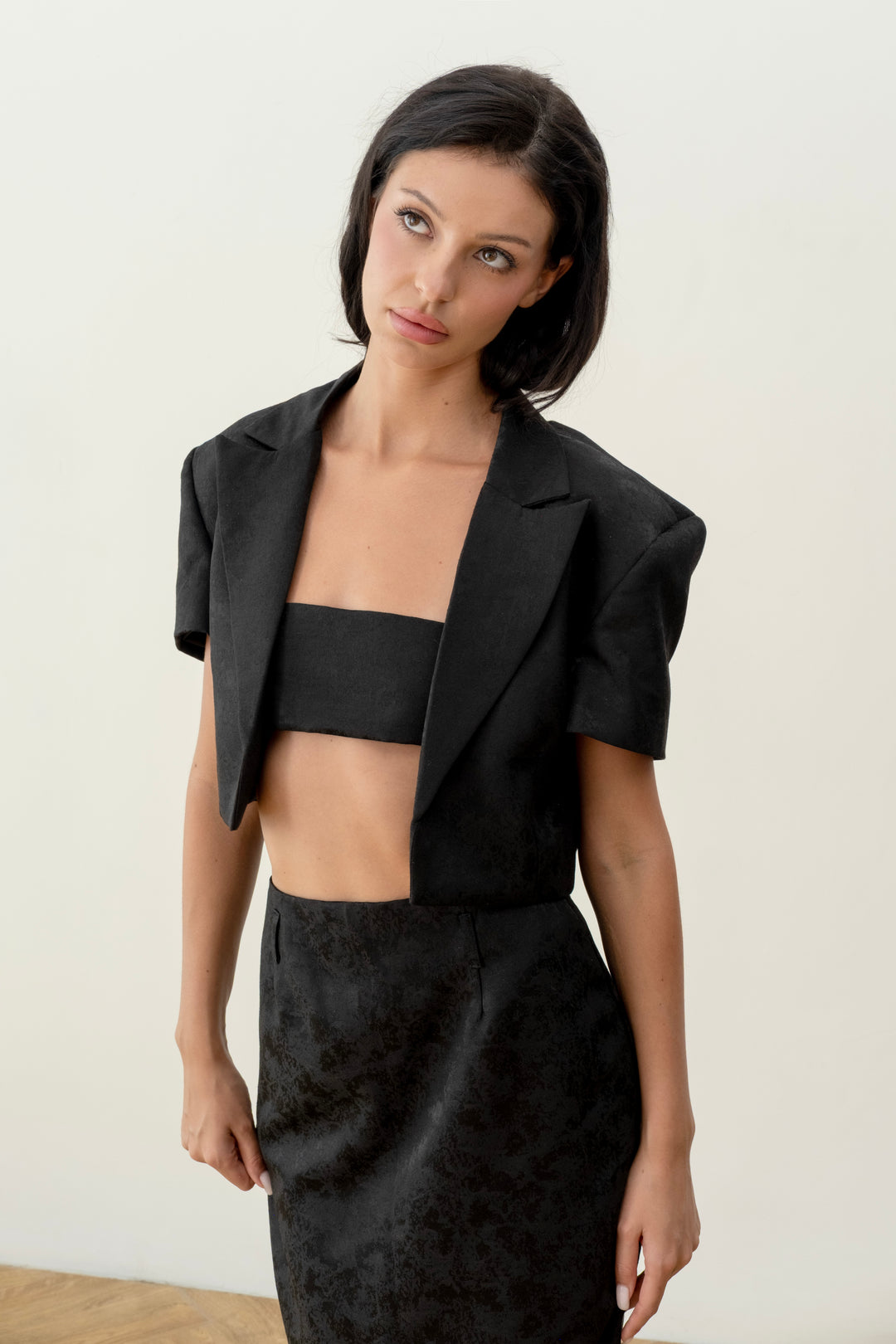 Short black print jacket with a scarf