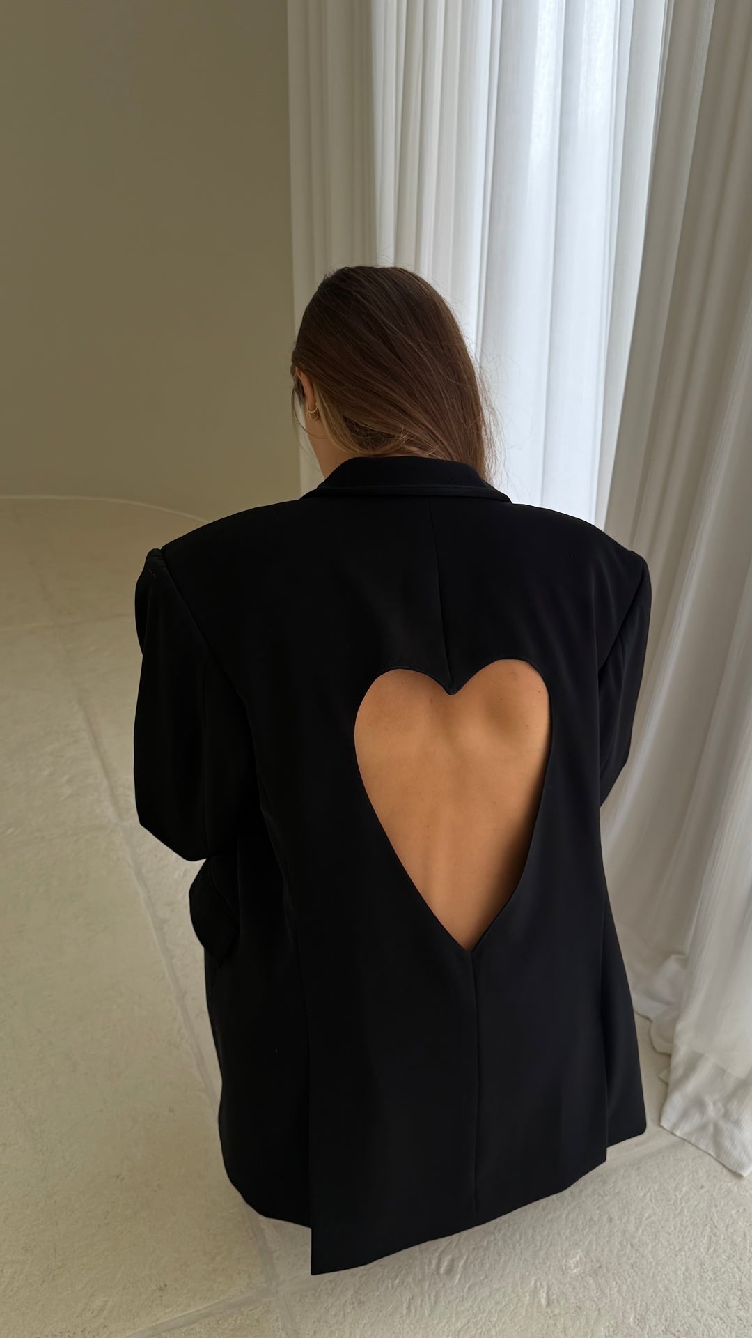 Black jacket with a heart on the back