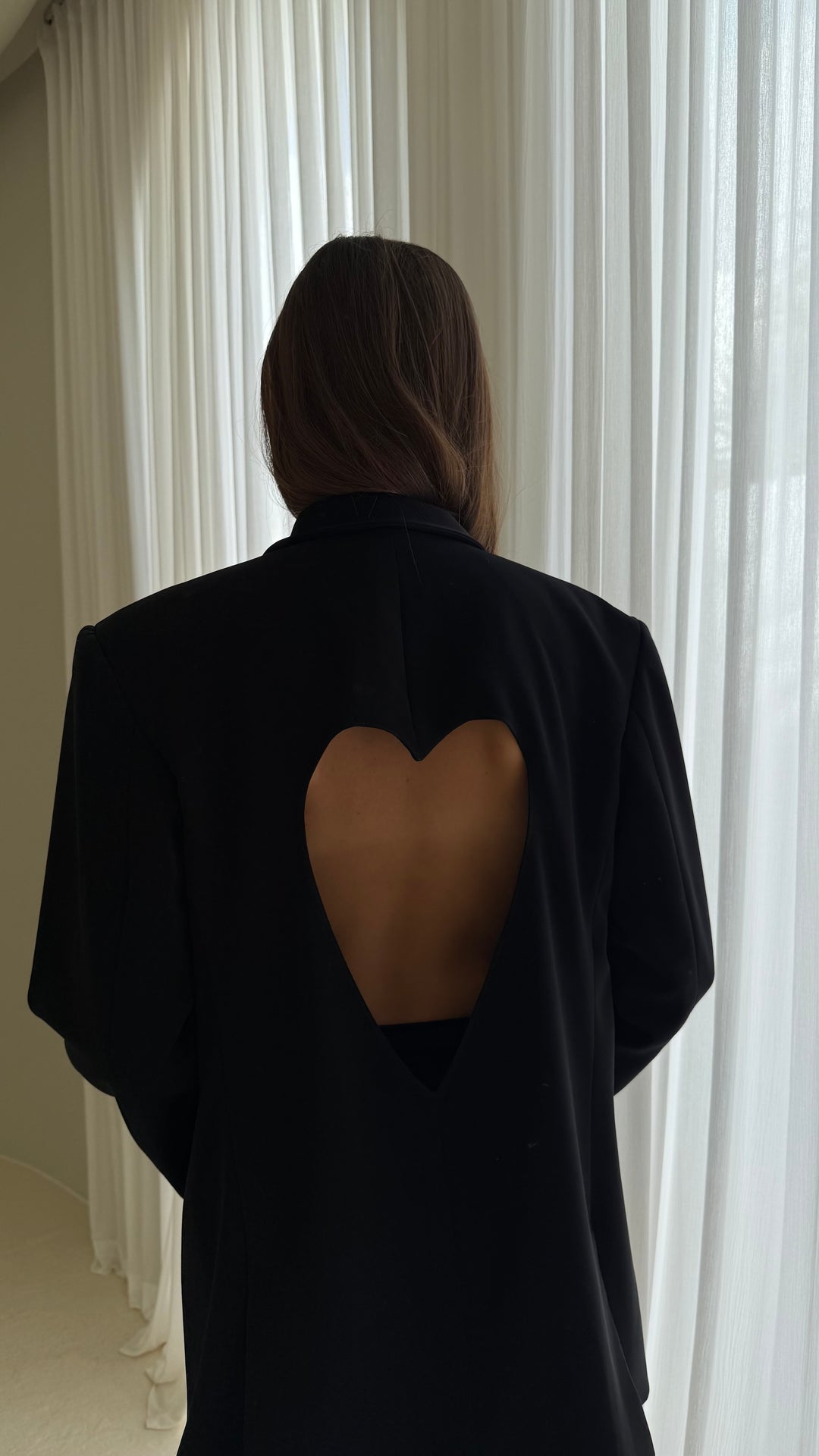 Black jacket with a heart on the back